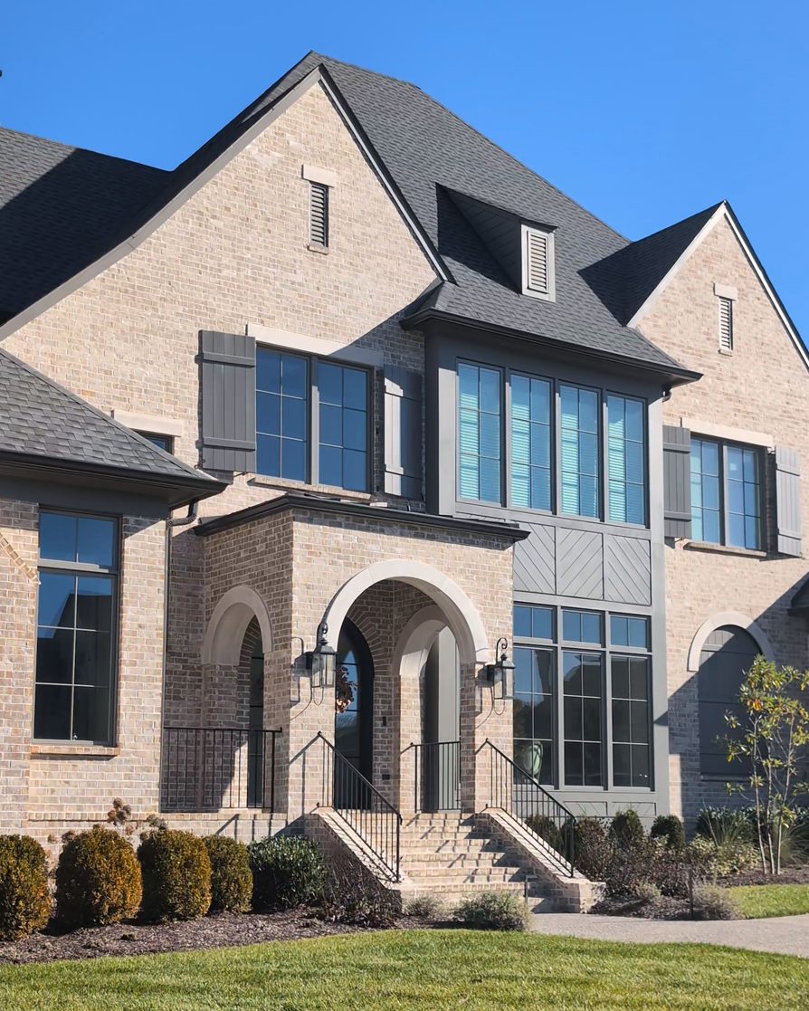A brick home in daylight with no lights