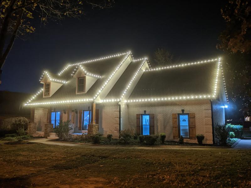 Long ranch-style roofline with bright white lights