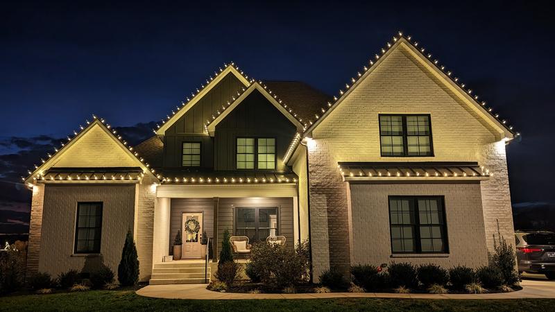 Craftsman home with three lit gables