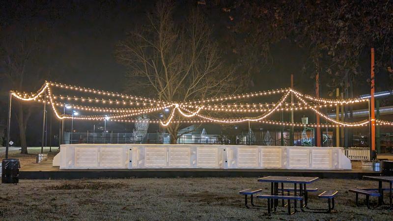Strings of lights draped across an outdoor event space